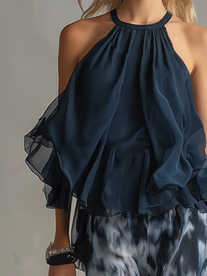 Ludovica - un elegante completo in chiffon composto da una camicetta con collo alto e pantaloni larghi a fantasia