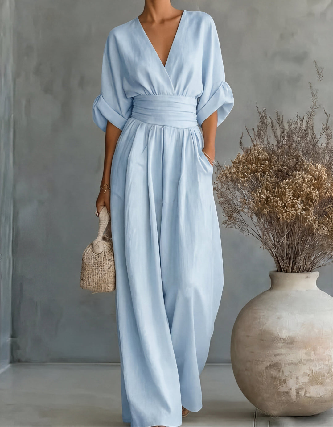 Daniela - Elegante tuta con scollo a V e pantaloni a zampa
