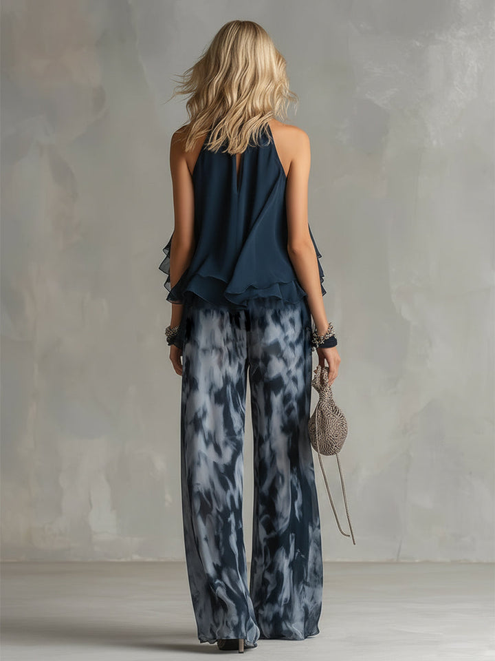 Ludovica - un elegante completo in chiffon composto da una camicetta con collo alto e pantaloni larghi a fantasia